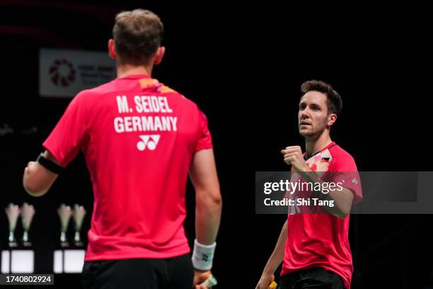 Mark Lamsfuss and Marvin Seidel of Germany react in the Men's Doubles First Round match against Zhou Haodong and Tan Qiang of China during day one of...