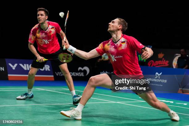 Mark Lamsfuss and Marvin Seidel of Germany compete in the Men's Doubles First Round match against Zhou Haodong and Tan Qiang of China during day one...