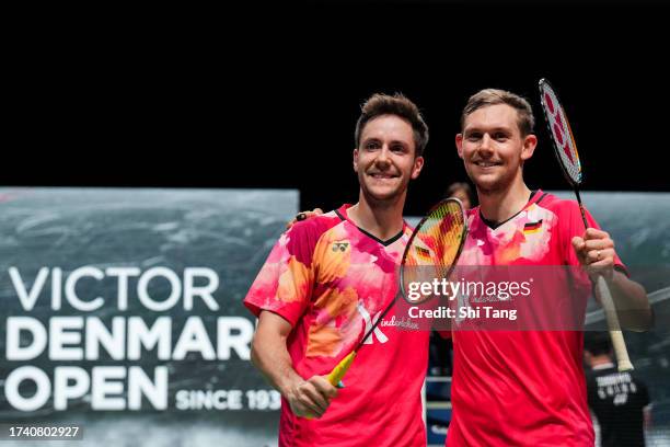 Mark Lamsfuss and Marvin Seidel of Germany celebrate the victory in the Men's Doubles First Round match against Zhou Haodong and Tan Qiang of China...