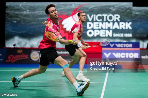 Mark Lamsfuss and Marvin Seidel of Germany compete in the Men's Doubles First Round match against Zhou Haodong and Tan Qiang of China during day one...