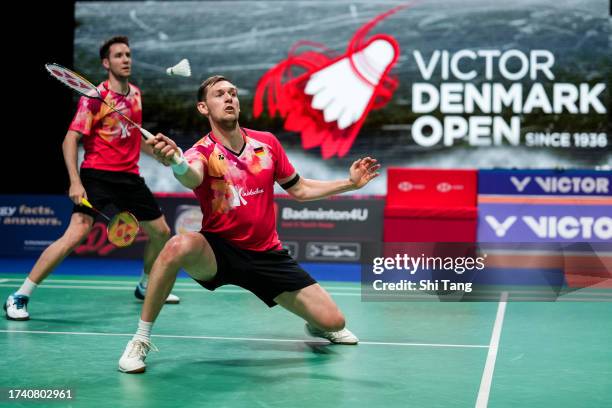 Mark Lamsfuss and Marvin Seidel of Germany compete in the Men's Doubles First Round match against Zhou Haodong and Tan Qiang of China during day one...