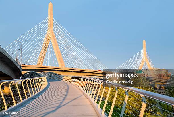 boston - north bank walkway and zakim bridge - zakim bridge stock pictures, royalty-free photos & images