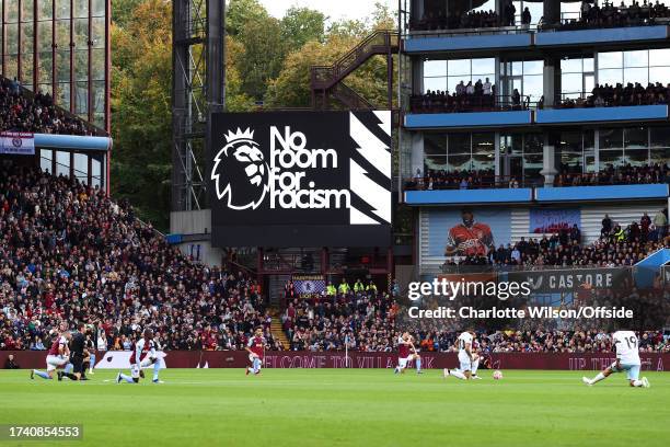 Players take the knee as part of the Premier League's No Room For Racism campaign ahead of the Premier League match between Aston Villa and West Ham...