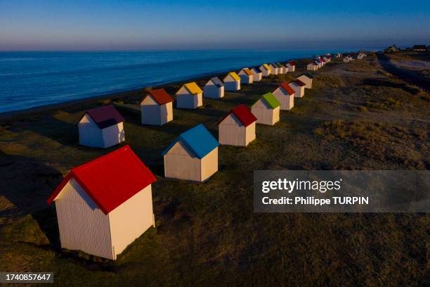 france, manche (50) gouville-sur-mer, the colorful beach huts - mer cotentin stock pictures, royalty-free photos & images