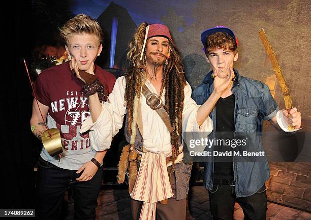 Greg West and Dan Ferrari-Lane of District 3 with Captain Jack Sparrow attend an exclusive launch event for upcoming videogame 'Disney Infinity',...