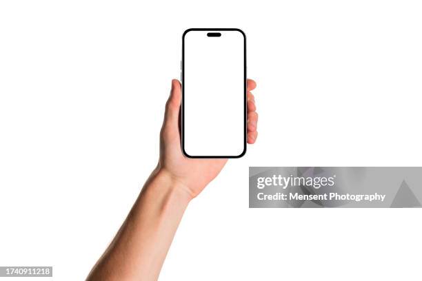 man hand holding modern blank smartphone mockup with white screen on white background - menselijke hand stockfoto's en -beelden