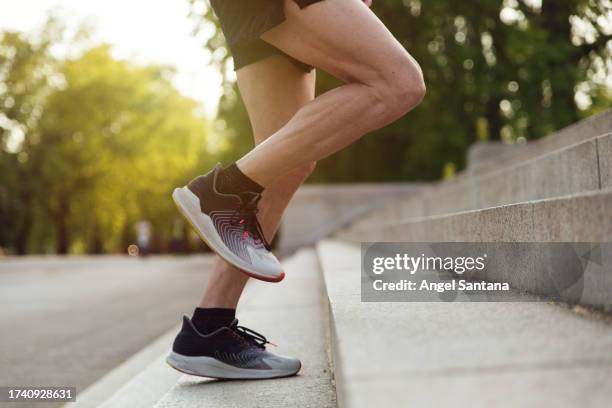 sportman legs running climbing stairs - leg stock pictures, royalty-free photos & images