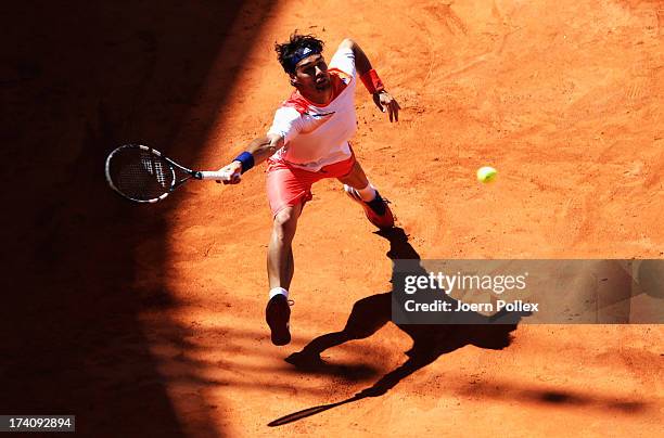 Fabio Fognini of Italy hits a forehand during his Semi Final match against Nicolas Almagro of Spain during the International German Open at...