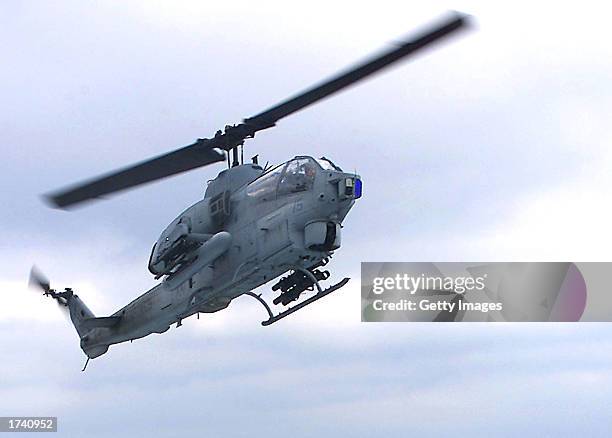 An AH-1W "Super Cobra" helicopter prepares to land on the amphibious assault ship USS Saipan January 17, 2003 at sea. Four U.S. Marines died when two...