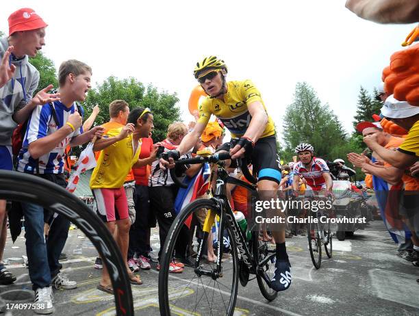 Chris Froome of Team Sky Pro Cycling makes his way through Dutch corner during stage eighteen of the 2013 Tour de France, a 172.5KM road stage from...