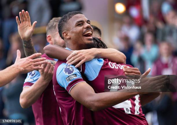 Lyle Foster of Burnley celebrates with goalscorer Wilson Odobert during the Premier League match between Burnley FC and Chelsea FC at Turf Moor on...