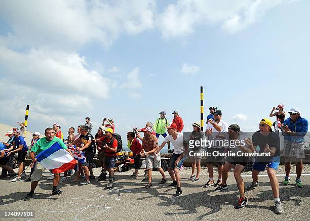 Spectators cheer on the riders at the top of Mont Ventoux during stage fifteen of the 2013 Tour de France, a 242.5KM road stage from Givors to Mont...