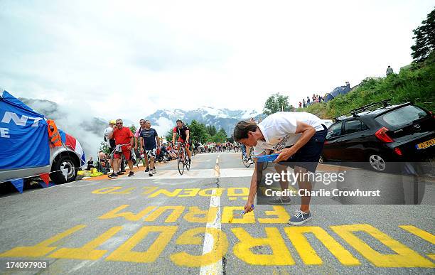 Spectator paints the road during stage eighteen of the 2013 Tour de France, a 172.5KM road stage from Gap to l'Alpe d'Huez, on July 18, 2013 in Alpe...