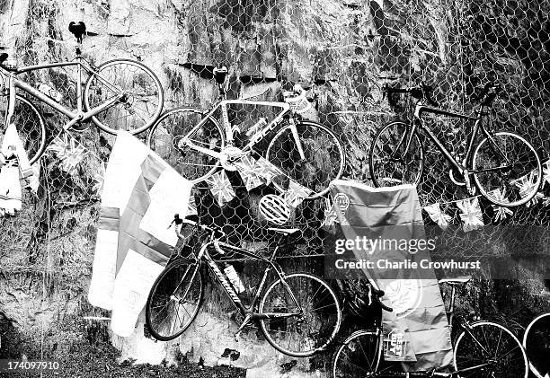 Spectators hang their bikes on a fence during stage eighteen of the 2013 Tour de France, a 172.5KM road stage from Gap to l'Alpe d'Huez, on July 18,...