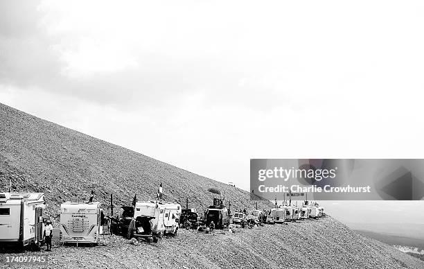 Spectators park their camper vans on the edge of the Mont Ventoux mountain during stage fifteen of the 2013 Tour de France, a 242.5KM road stage from...