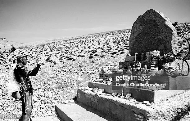 Spectator takes a photo of the Tommy Simpson memorial during stage fifteen of the 2013 Tour de France, a 242.5KM road stage from Givors to Mont...