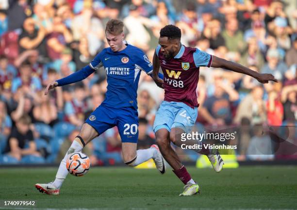 Cole Palmer of Chelsea and Hannes Delcroix of Burnley in action during the Premier League match between Burnley FC and Chelsea FC at Turf Moor on...