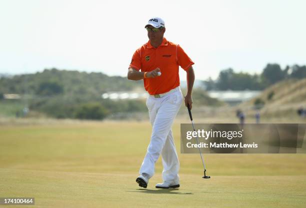 Lee Westwood of England reacts after making an eagle putt on the 5th hole during the third round of the 142nd Open Championship at Muirfield on July...