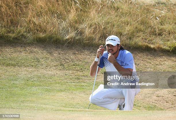 Jason Day of Australia lines up a putt on the 13th during the third round of the 142nd Open Championship at Muirfield on July 20, 2013 in Gullane,...