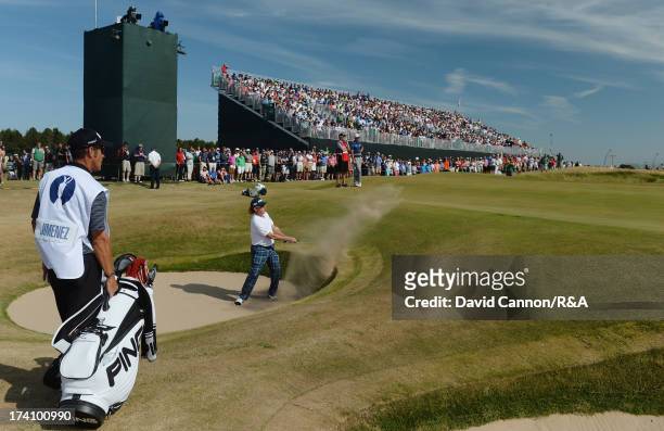 Miguel Angel Jimenez of Spain plays his fourth shot out of a bunker on the fifth hole during the third round of the 142nd Open Championship at...