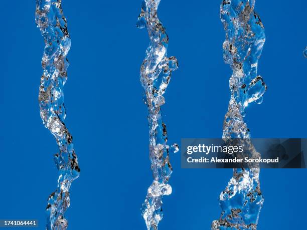 drops of falling water frozen in the air. frozen movement. - rainwater basin stock pictures, royalty-free photos & images