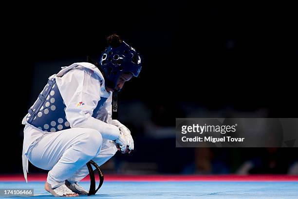 Elizabeth Alvarado of Peru reacts after losing against Amanda Sanchez of Costa Rica during a women's -57 kg combat of WTF World Taekwondo...