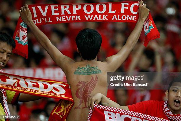 Fans with tattoo of Liverpool logo on his body during the match between the Indonesia XI and Liverpool FC on July 20, 2013 in Jakarta, Indonesia.