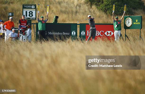 Tiger Woods of the United States tees off on the 18th during the third round of the 142nd Open Championship at Muirfield on July 20, 2013 in Gullane,...