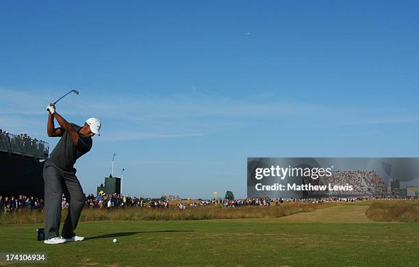 Tiger Woods of the United States tees off on the 16th during the third round of the 142nd Open Championship at Muirfield on July 20, 2013 in Gullane,...