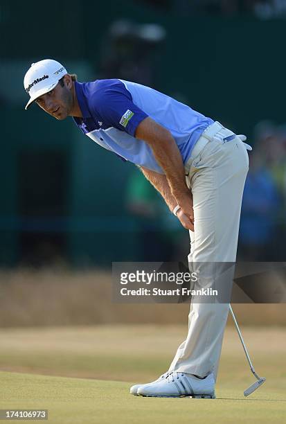Dustin Johnson of the United States reacts on the 18th green during the third round of the 142nd Open Championship at Muirfield on July 20, 2013 in...