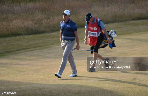 Henrik Stenson of Sweden walks down the 18th hole during the third round of the 142nd Open Championship at Muirfield on July 20, 2013 in Gullane,...