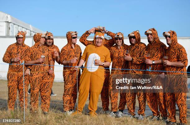 Golf fans in tiger costumes watch the action during the third round of the 142nd Open Championship at Muirfield on July 20, 2013 in Gullane, Scotland.
