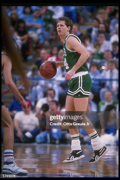 Danny Ainge of the Boston Celtics moves the ball during the 1988-1989 NBA game against the Denver Nuggetts in Denver, Colorado. NOTE TO USER: User...