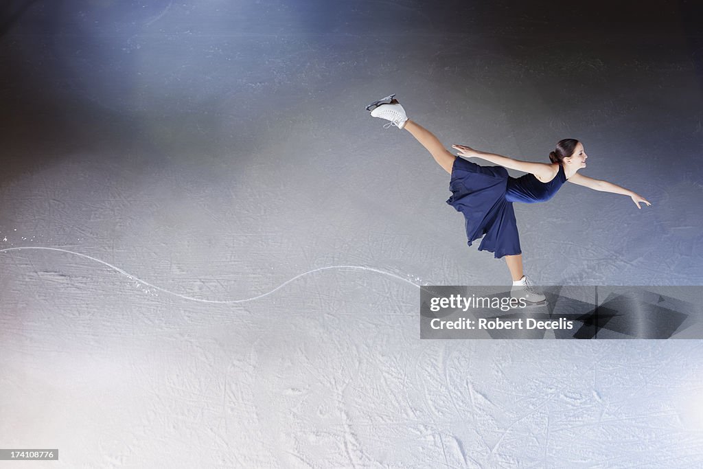 Skater making edge in ice, showing path.