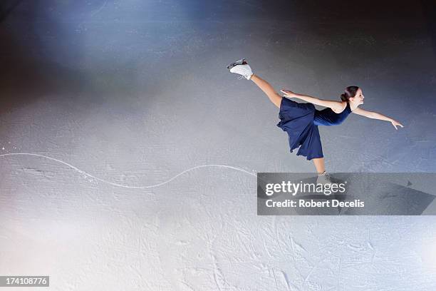 skater making edge in ice, showing path. - ice skating fotografías e imágenes de stock