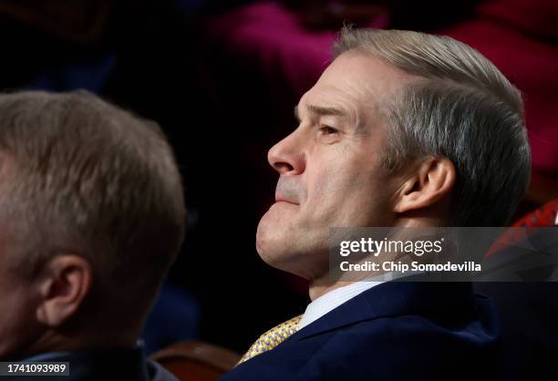 Rep. Jim Jordan listens to nomination speeches for Speaker of the House as the House of Representatives prepares to vote on a new Speaker at the U.S....