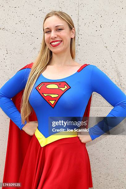 Guest in a Superwoman costume attends Comic-Con International 2013 - Day 3 on July 20, 2013 in San Diego, California.