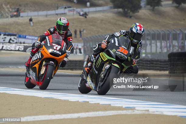 Bradley Smith of Great Britain and Monster Yamaha Tech 3 leads Claudio Corti of Italy and NGM Mobile Forward Racing during the MotoGp Red Bull U.S....