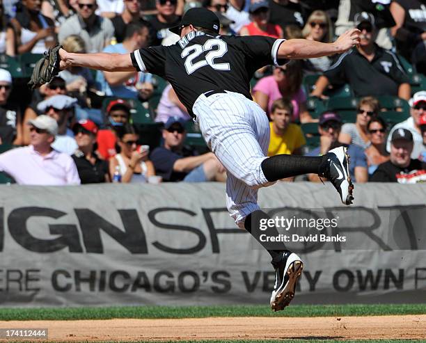 Brent Morel of the Chicago White Sox makes a leaping catch on Andrelton Simmons of the Atlanta Braves during the second inning on July 20, 2013 at...