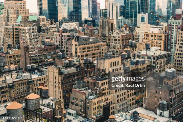 manhattan buildings view sunny day at sunset.skyline view ny city . - new york vacation rooftop stock pictures, royalty-free photos & images