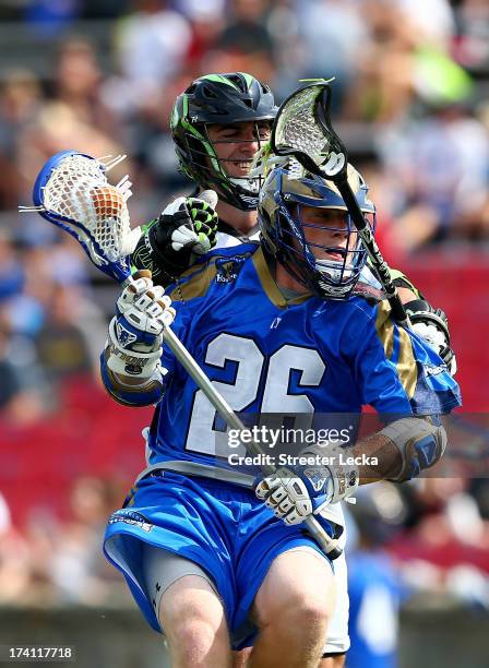 John Haus of the Charlotte Hounds is hit by Max Seibald of the New York Lizards at American Legion Memorial Stadium on July 20, 2013 in Charlotte,...