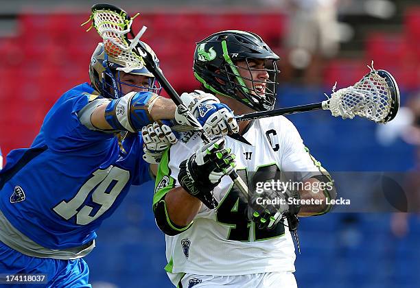 Max Seibald of the New York Lizards is hit from behind by Kevin Drew of the Charlotte Hounds at American Legion Memorial Stadium on July 20, 2013 in...