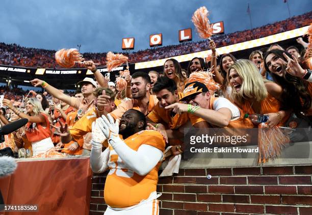 Isaac Green of the Tennessee Volunteers celebrates with the student section following their win over the Texas A&M Aggies at Neyland Stadium on...