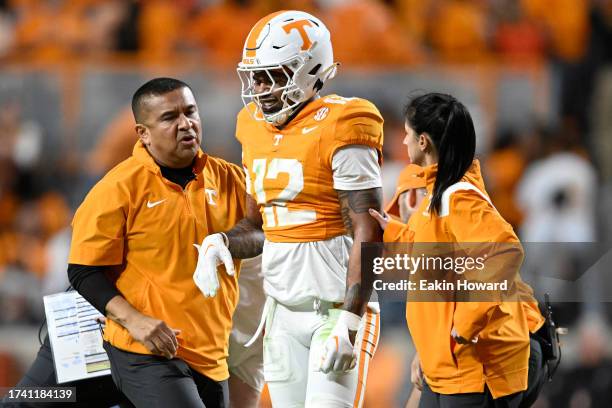 Tamarion McDonald of the Tennessee Volunteers is helped off the field after an injury against the Texas A&M Aggies in the fourth quarter at Neyland...