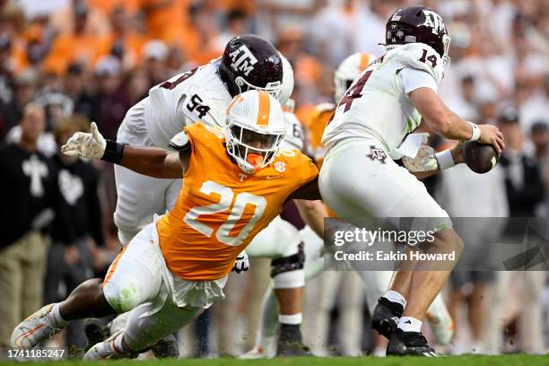 Bryson Eason of the Tennessee Volunteers attempts to sack Max Johnson of the Texas A&M Aggies in the fourth quarter at Neyland Stadium on October 14,...