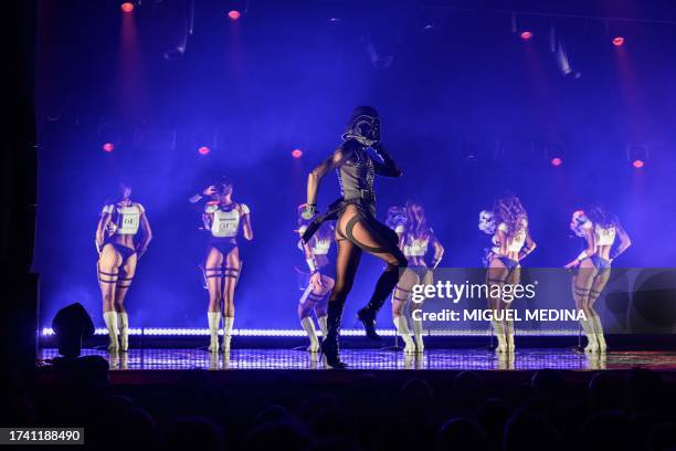 Dancers perform in "The Empire Strips Back", a burlesque parody of Star Wars at the Marie-Bell gymnasium theater in central Paris on October 22,...