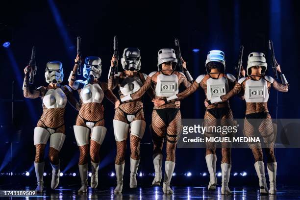 Dancers perform in "The Empire Strips Back", a burlesque parody of Star Wars at the Marie-Bell gymnasium theater in central Paris on October 22,...