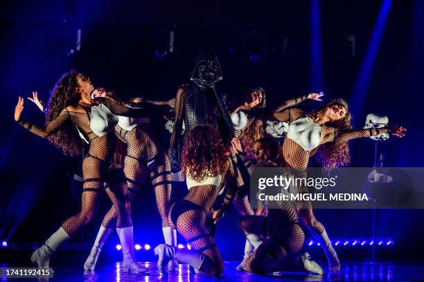 Dancers perform in "The Empire Strips Back", a burlesque parody of Star Wars at the Marie-Bell gymnasium theater in central Paris on October 22,...