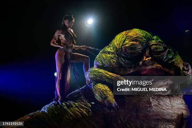 Dancer performs in "The Empire Strips Back", a burlesque parody of Star Wars at the Marie-Bell gymnasium theater in central Paris on October 22,...