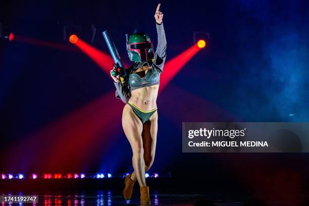 Dancer performs in "The Empire Strips Back", a burlesque parody of Star Wars at the Marie-Bell gymnasium theater in central Paris on October 22,...